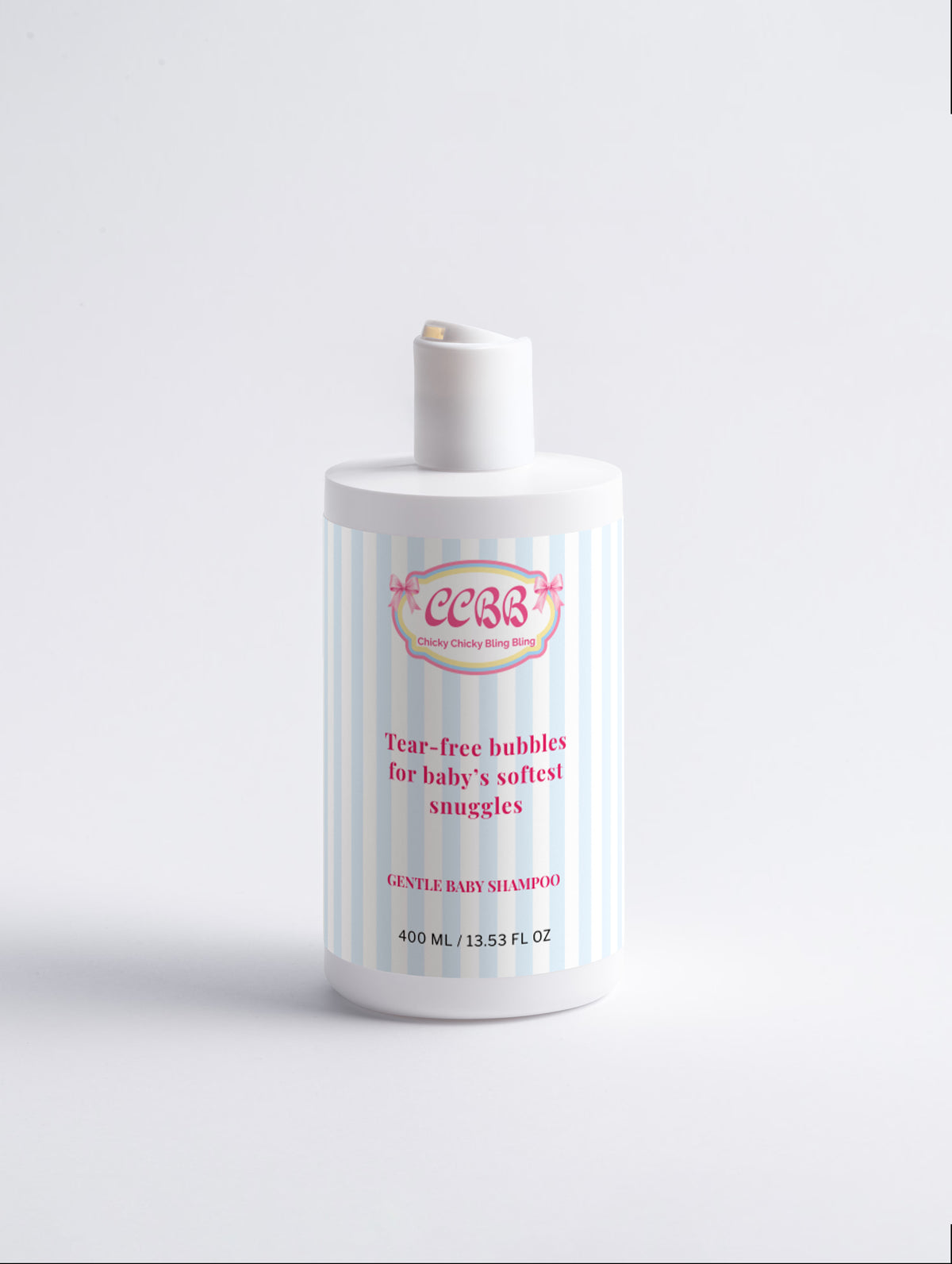 A bottle of baby shampoo with a white cap and a white label featuring light blue vertical stripes and pink text, set against a plain white background.
