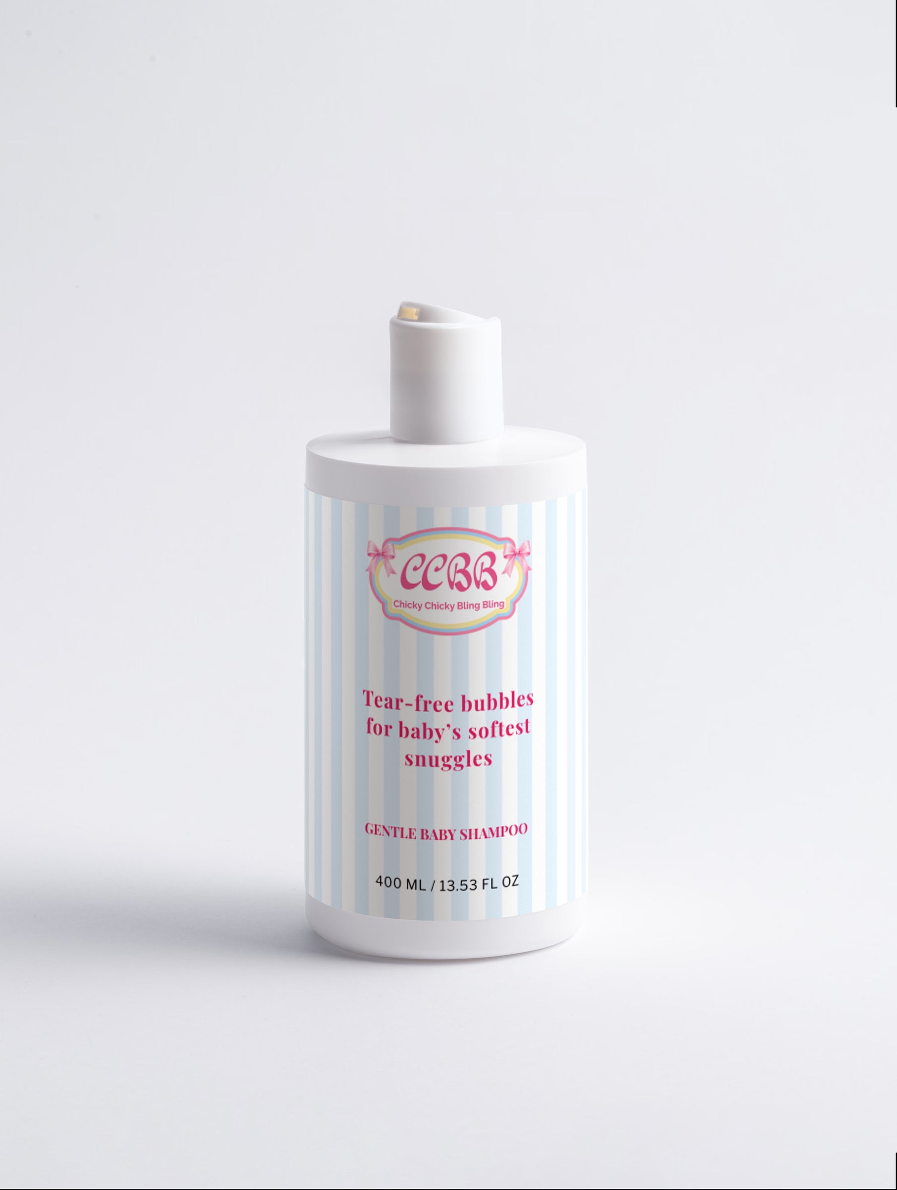 A bottle of baby shampoo with a white cap and a white label featuring light blue vertical stripes and pink text, set against a plain white background.