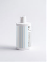 Fresh Conditioner Citrus Cocktail white bottle with blue and white striped label on a white background