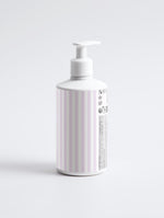 Side angle view of the Moisturizing Shampoo bottle showcasing clean white packaging