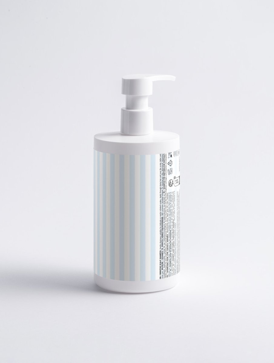 COSMOS Natural Sensitive Scalp Shampoo bottle angled view showcasing soothing formula